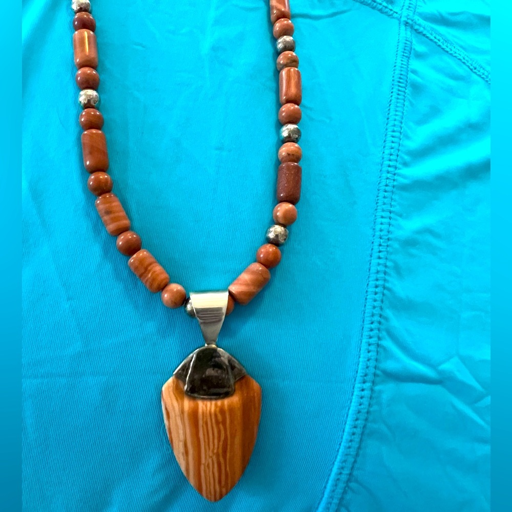 Silver and petrified wood necklace. Natural stones.